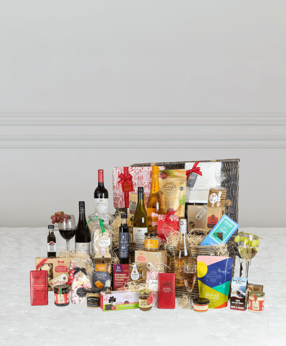 website banner image displaying a selection of wines and chocolates from Erin Hampers with calls to action to enter the product range